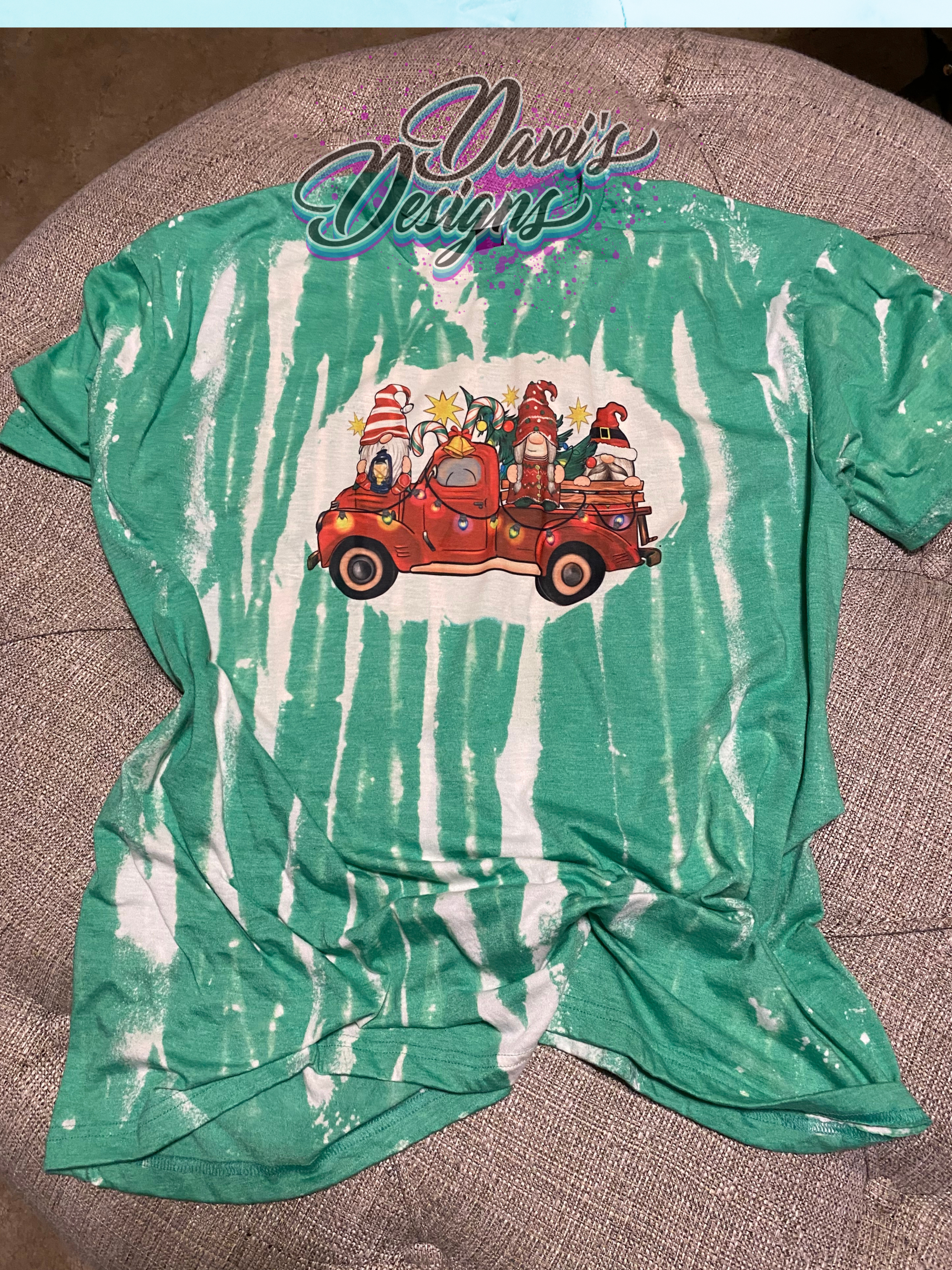 Heather Irish Green bleach patterned tee with red truck and Gnomes with a Christmas lights and Christmas tree.