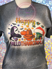 Dark Heather Bleached tee with Happy HalloThanksMas quote and images of bats, witch hat, pumpkins, Christimas presents, mistletoe, and Santa hat.