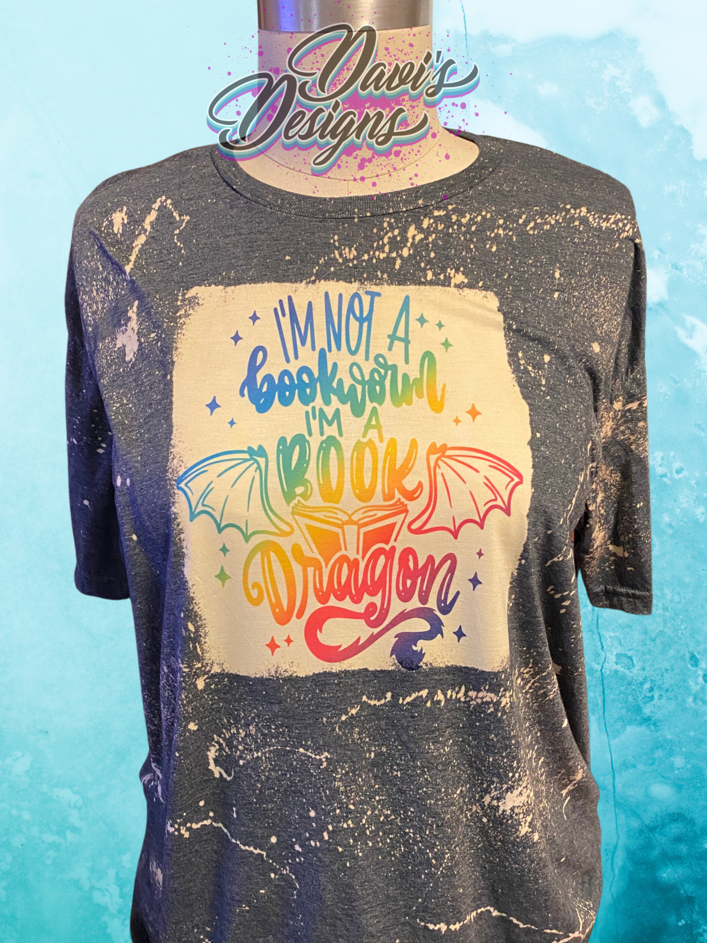 Dark Heather bleach patterned tee with quote I'm Not a Bookworm I'm a Book Dragon in rainbow colors