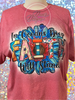 Heather Cardinal tee with In Oceans Deep Faith Will Stand in colorful print over a blue flower.