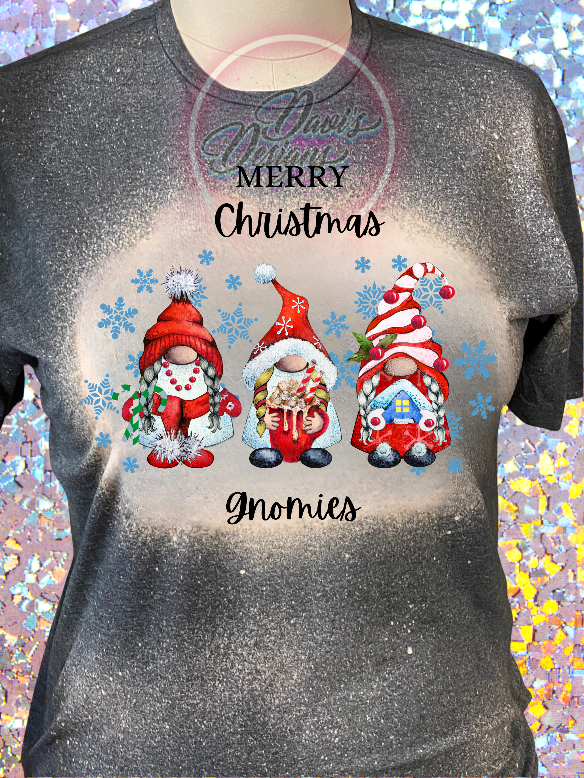 Dark Heather Bleached tee with Merry Christmas Gnomies quote and images of three gnomes dressed in Christmas hats and Christmas clothes.