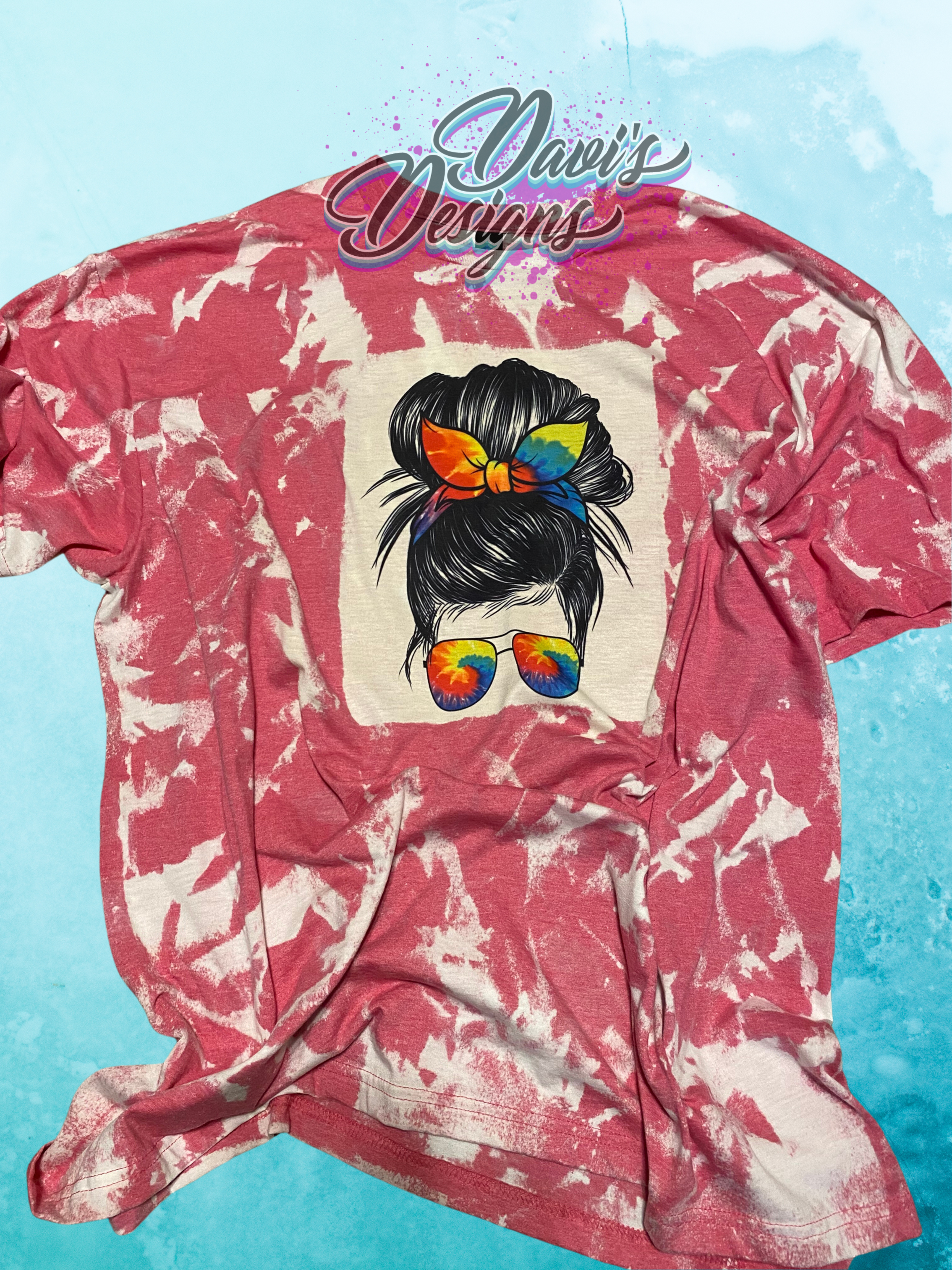 Heather Heliconia bleach patterned tee with tie-dye Messy Bun.