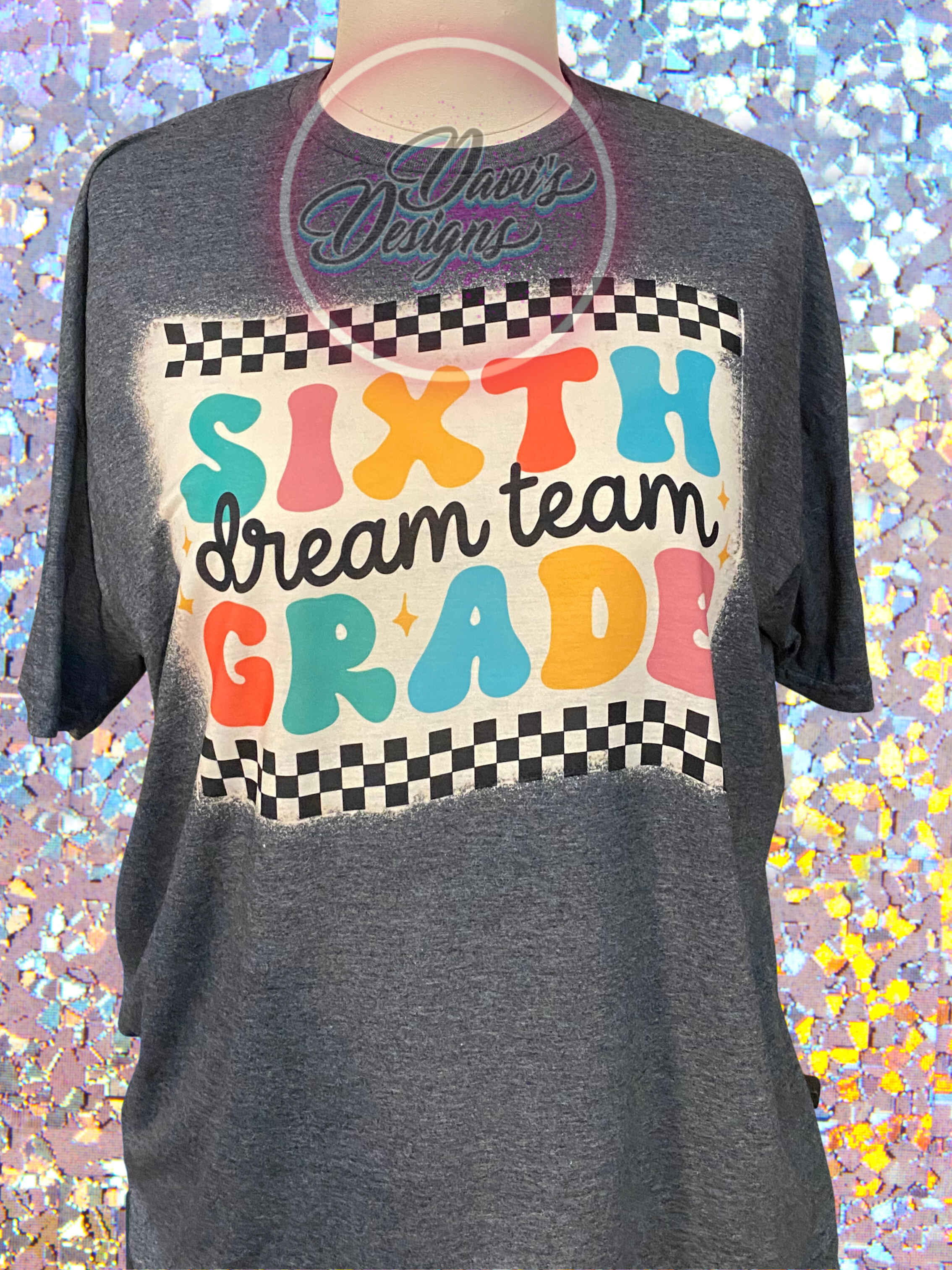 Dark Heather bleach patterned tee with quote Sixth Grade Dream Team on a racing flag.