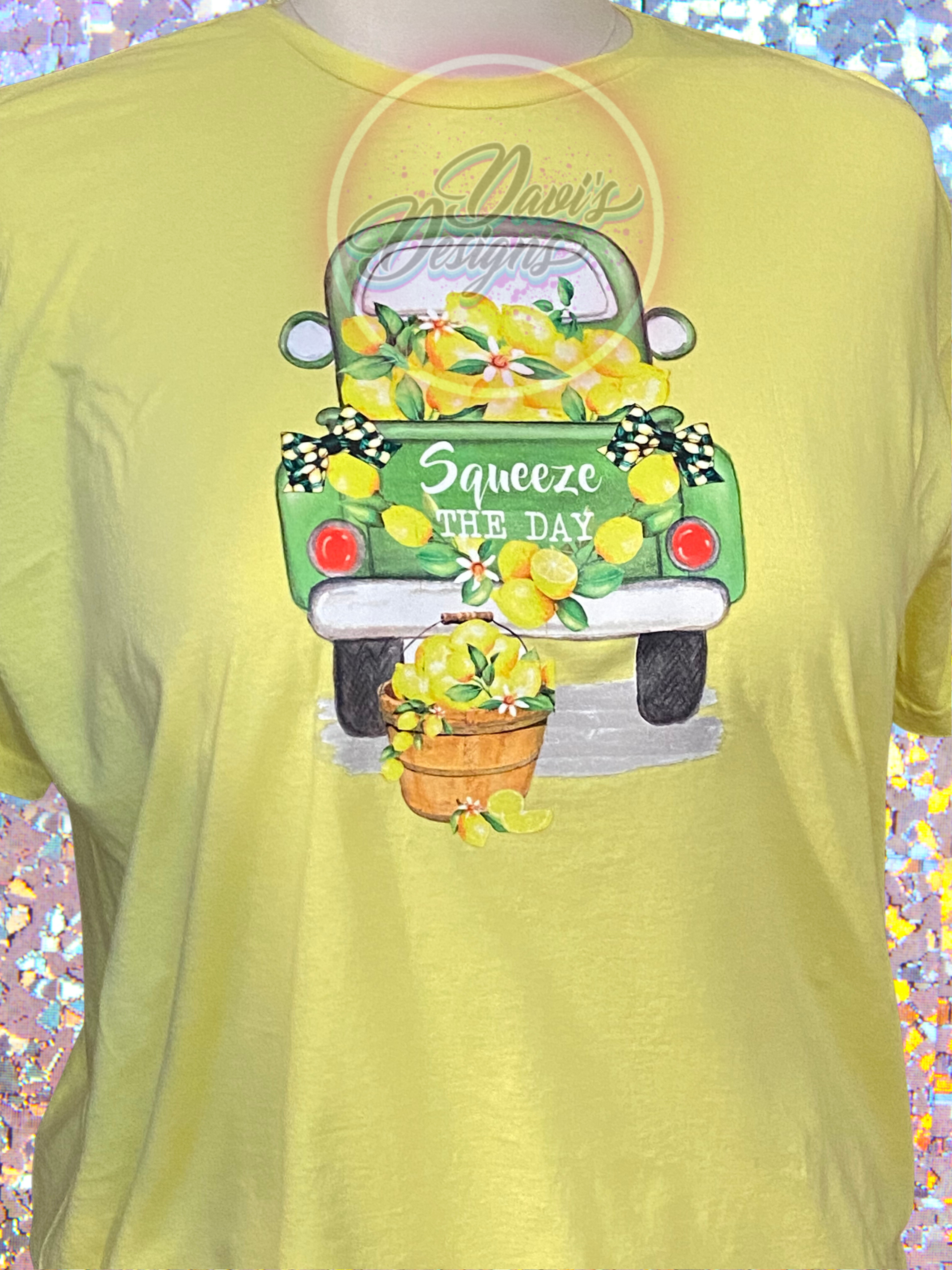 Cornsilk Yellow tee with a green truck full of lemons that says Squeeze the Day.