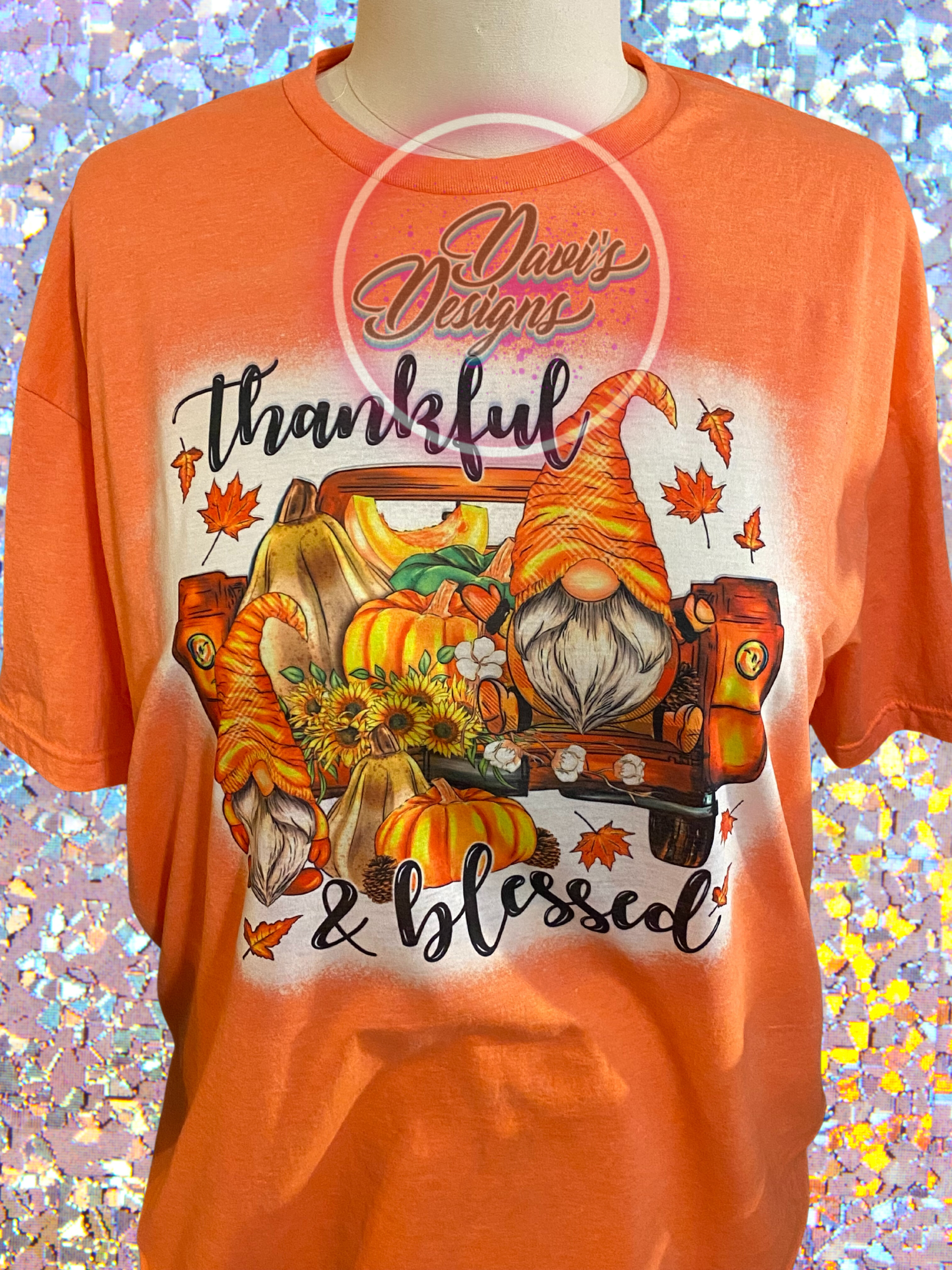 Heather Orange bleached shirt with image of gnomes in the back of a truck with pumpkins saying Thankful and Blessed.